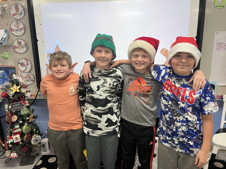 students wearing holiday headgear