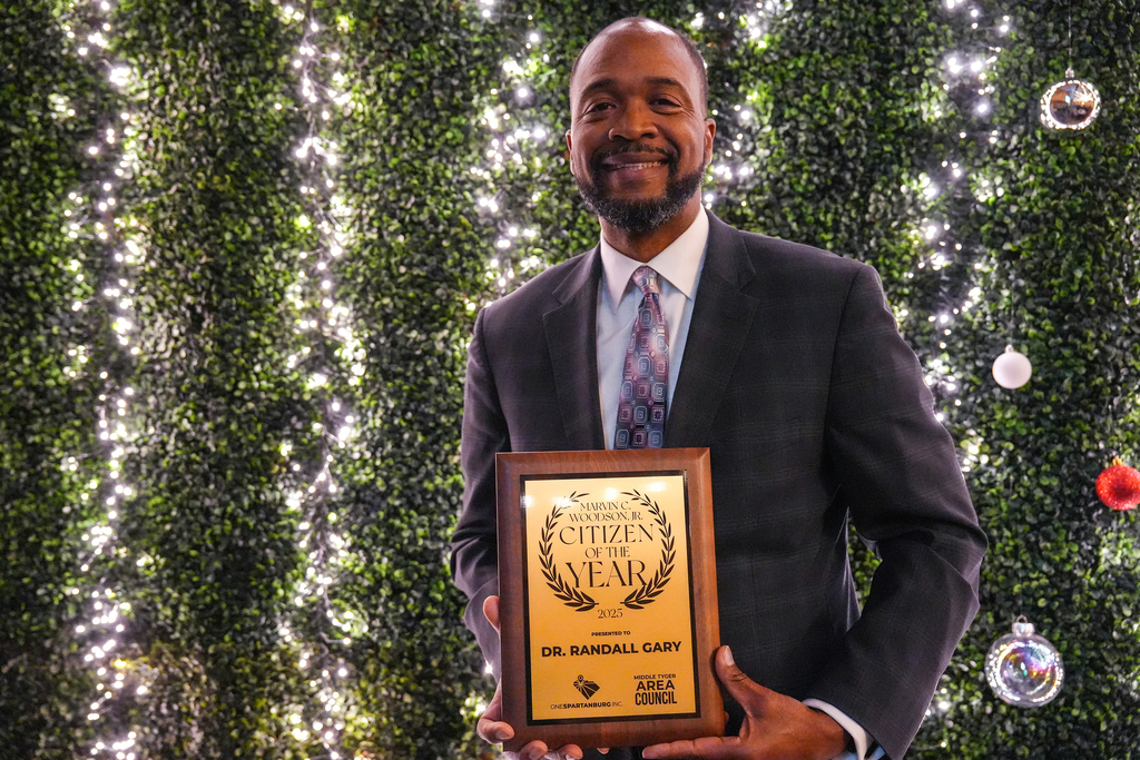 Dr. Gary accepting award