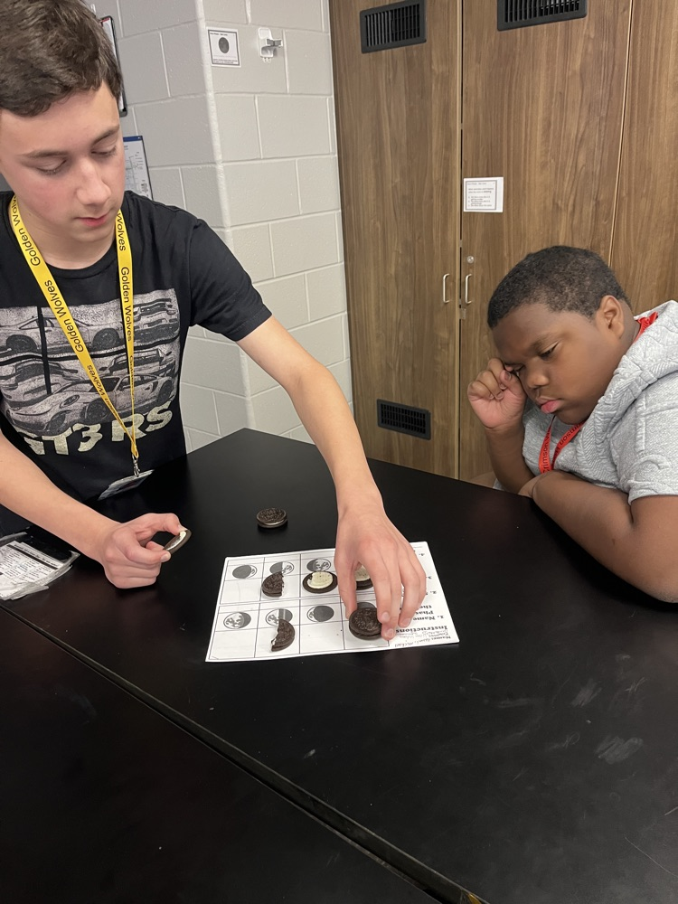 kids with Oreos and moon phases 