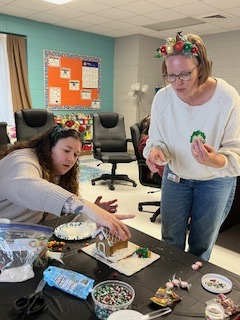 teachers participating in a ginger house decorating contest.