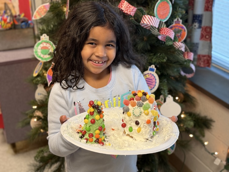 students decorating gingerbread houses