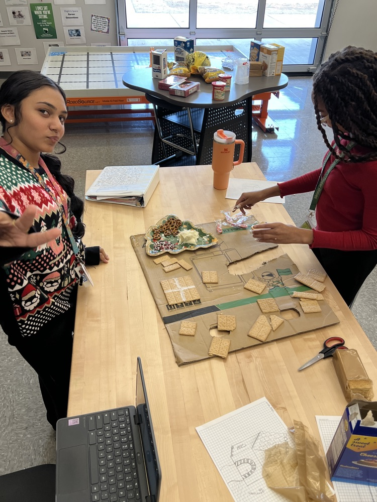 kids making gingerbread houses