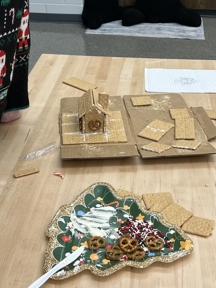 kids making gingerbread houses