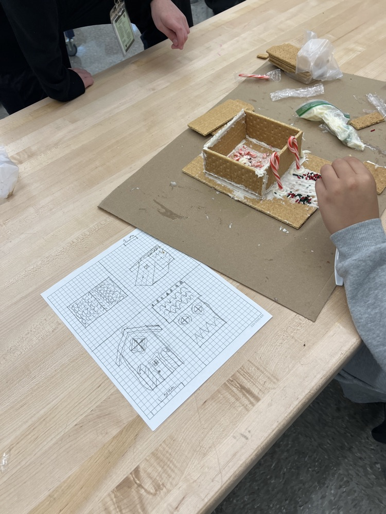 kids making gingerbread houses