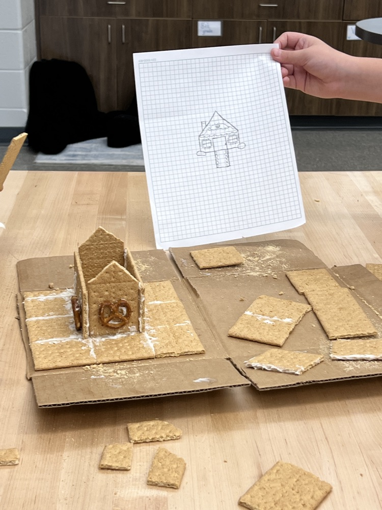 kids making gingerbread houses