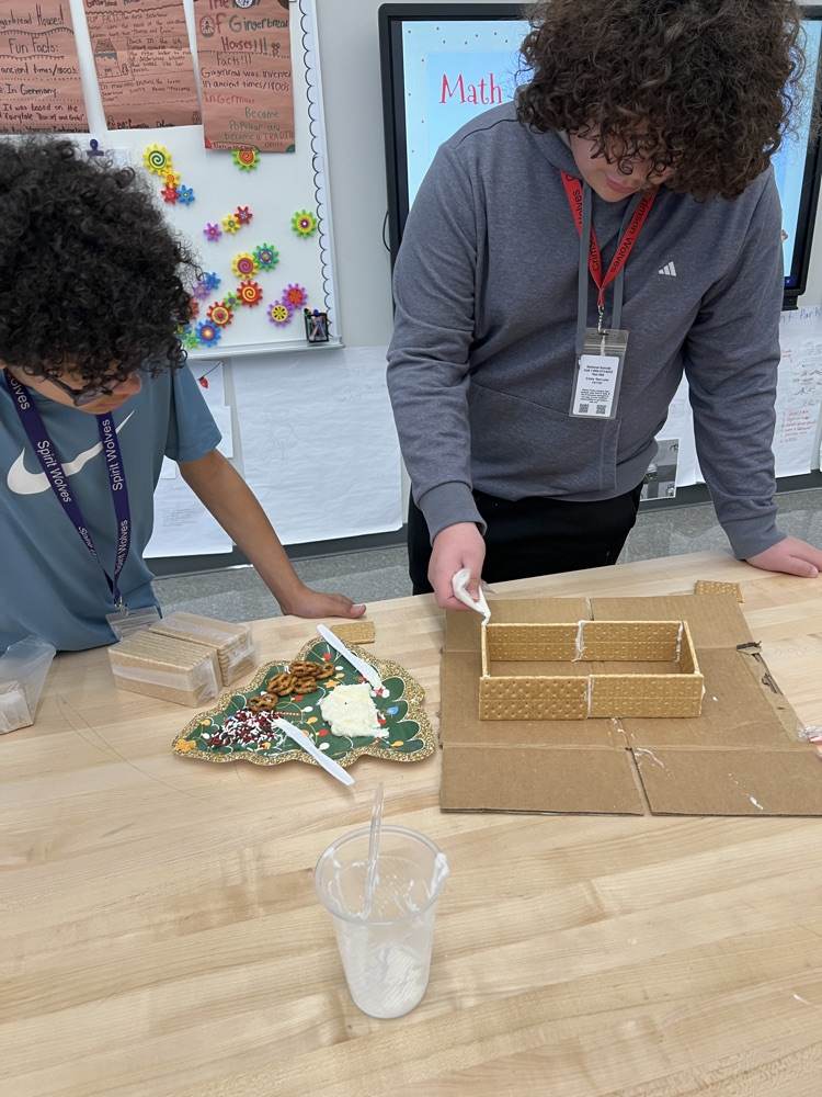 kids making gingerbread houses