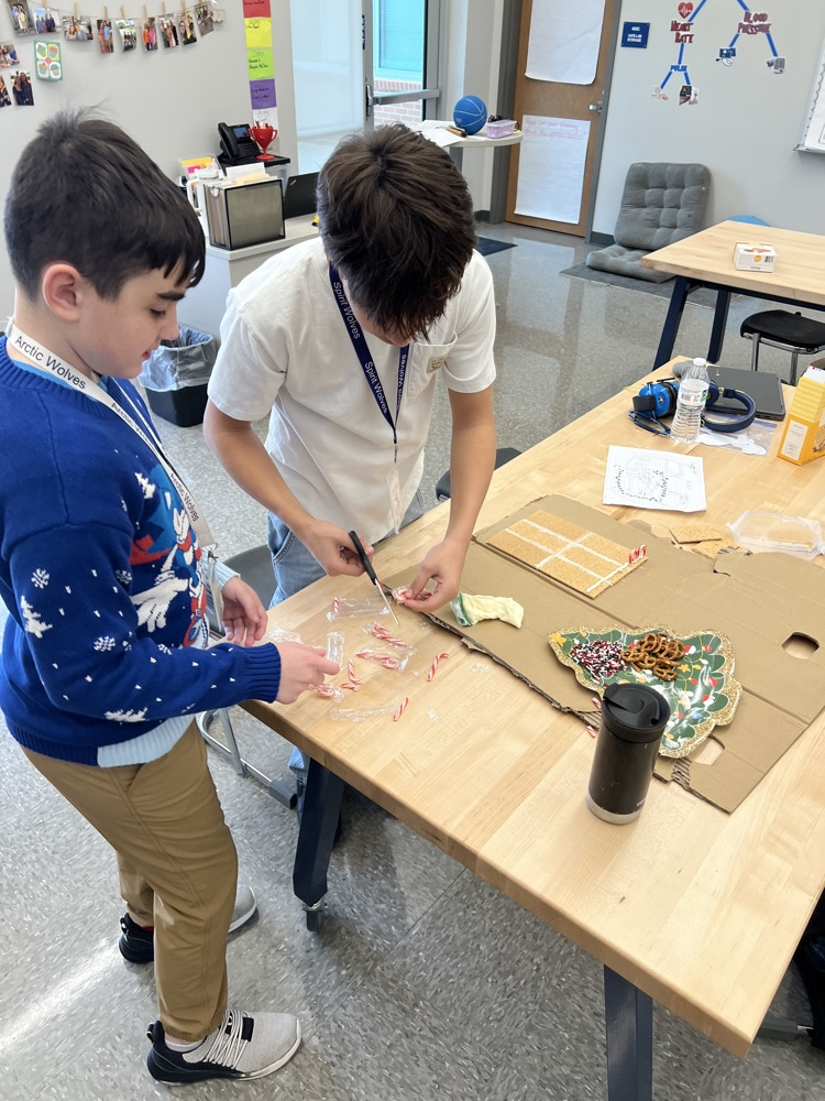 kids making gingerbread houses