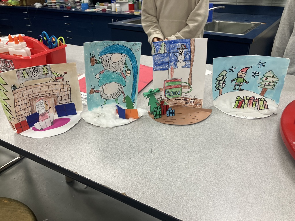 After the Holiday Card Contest judging was complete, Mrs. Goode's art students used their holiday card entries to create these amazing dioramas!  Love their holiday cheer!   