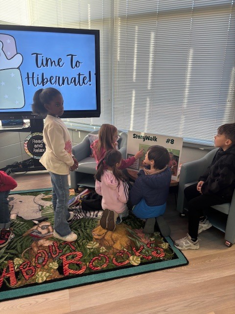 students reading and walking around library
