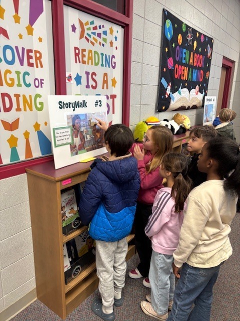 students reading and walking around library