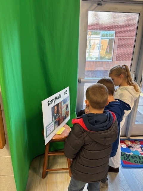 students reading and walking around library