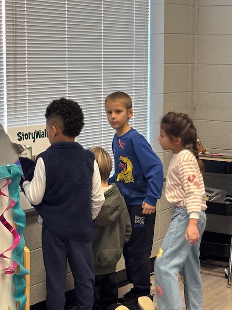 students reading and walking around library