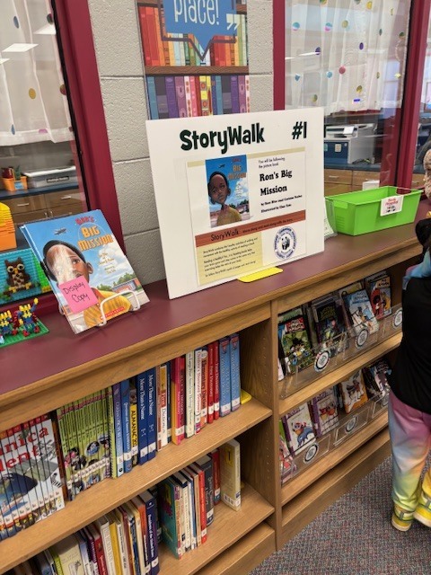 students reading and walking around library