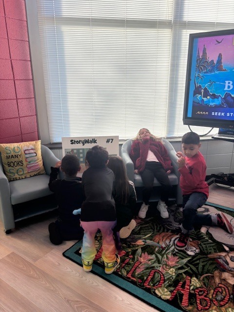 students reading and walking around library