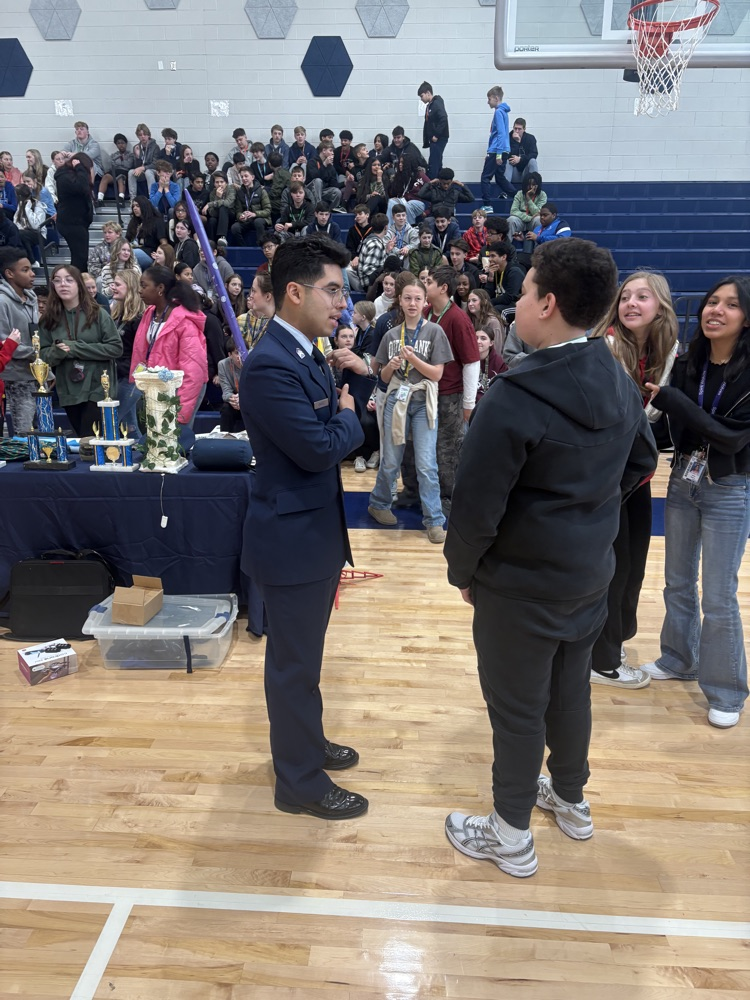students working hands-on in the gym