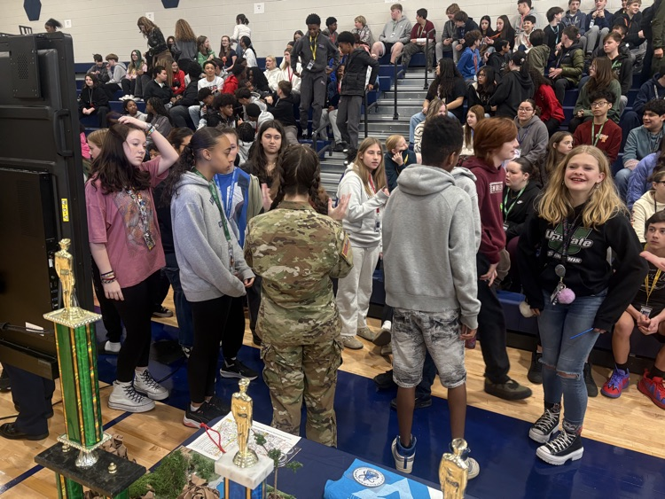 students working hands-on in the gym