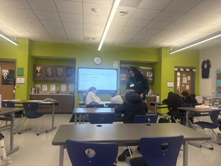 students working with visitor