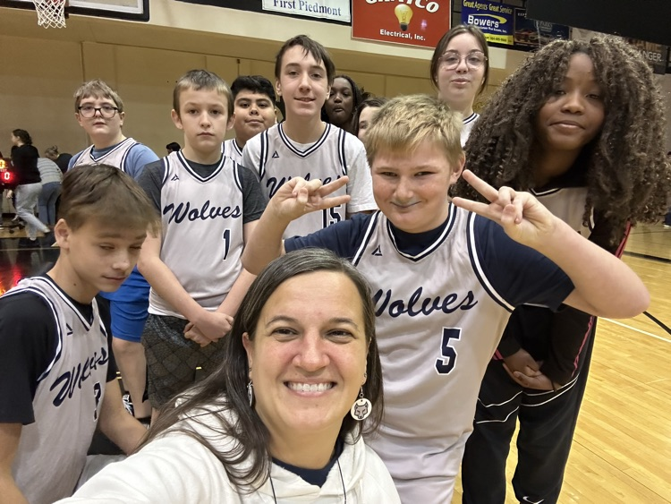 teacher and kids at basketball