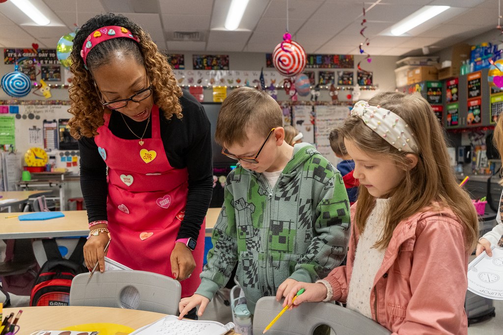 teacher helping student