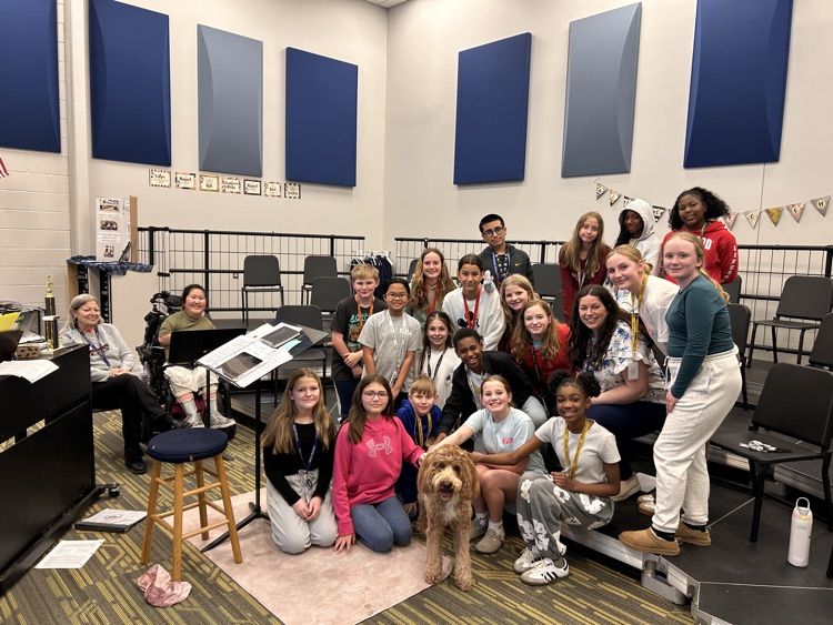 chorus students with a dog 