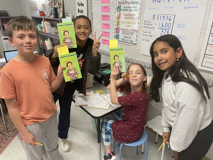 We started book clubs today. They are making predictions and connections.