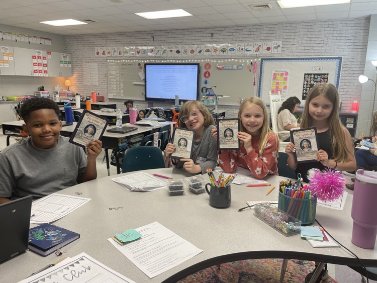 We started book clubs today. They are making predictions and connections.