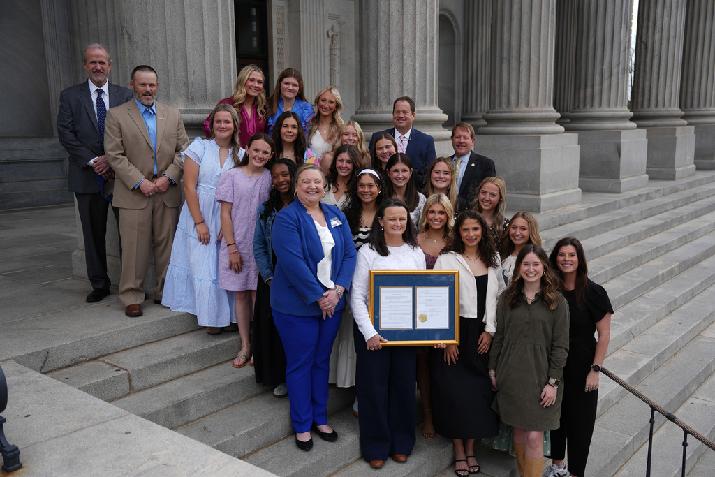 softball team on statehouse steps