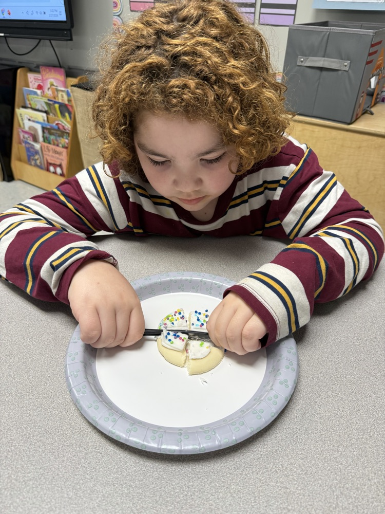 We are learning about fractions and the students were able to show their knowledge by cutting different fractions on their cookie.