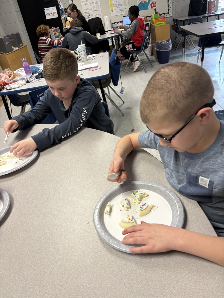 We are learning about fractions and the students were able to show their knowledge by cutting different fractions on their cookie.