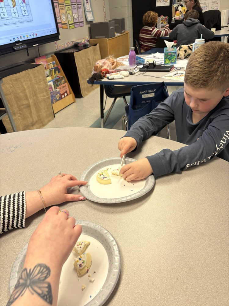 We are learning about fractions and the students were able to show their knowledge by cutting different fractions on their cookie.
