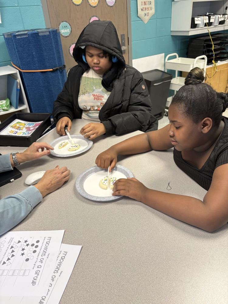 We are learning about fractions and the students were able to show their knowledge by cutting different fractions on their cookie.