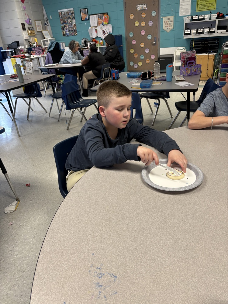 We are learning about fractions and the students were able to show their knowledge by cutting different fractions on their cookie.