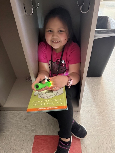 What’s better than reading in Mrs. Wells’ class? Reading by flashlight on Read Across America Day!