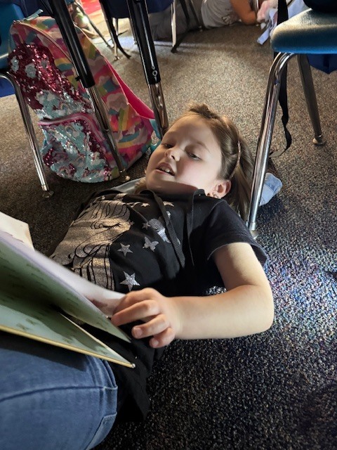 What’s better than reading in Mrs. Wells’ class? Reading by flashlight on Read Across America Day!