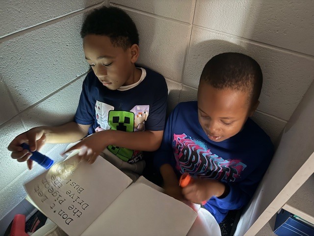 What’s better than reading in Mrs. Wells’ class? Reading by flashlight on Read Across America Day!