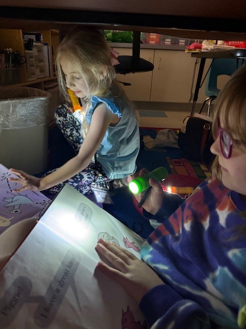 What’s better than reading in Mrs. Wells’ class? Reading by flashlight on Read Across America Day!