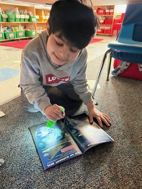 What’s better than reading in Mrs. Wells’ class? Reading by flashlight on Read Across America Day!