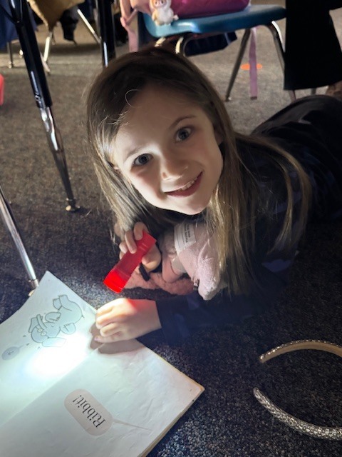 What’s better than reading in Mrs. Wells’ class? Reading by flashlight on Read Across America Day!