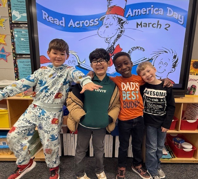 Children wearing t-shirts with text on them