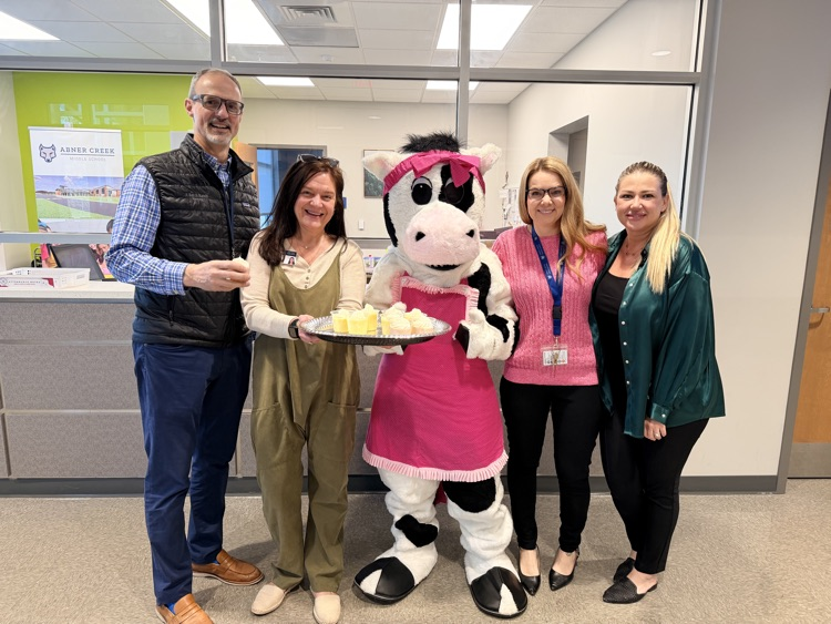 admin with smoothies and a cow mascot 