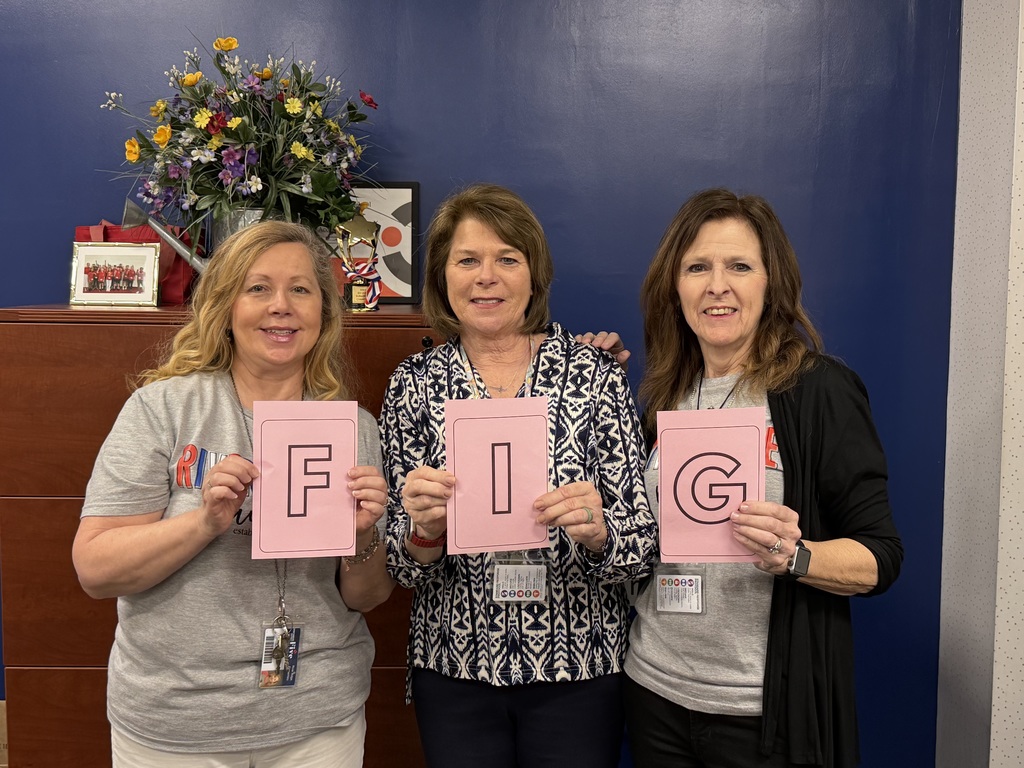 teachers holding scrabble letters