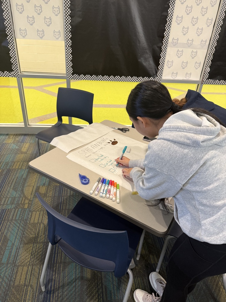 students creating boxes and posters