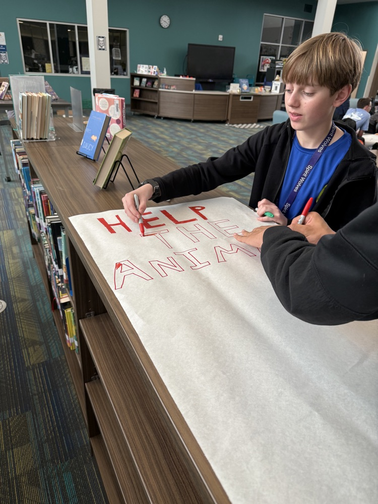 students creating boxes and posters