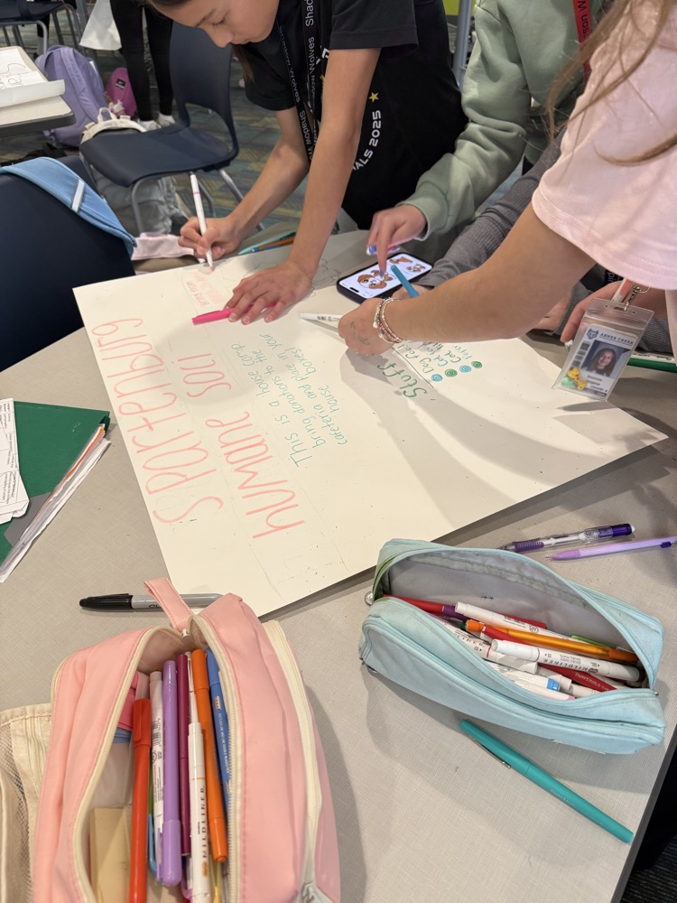 students creating boxes and posters