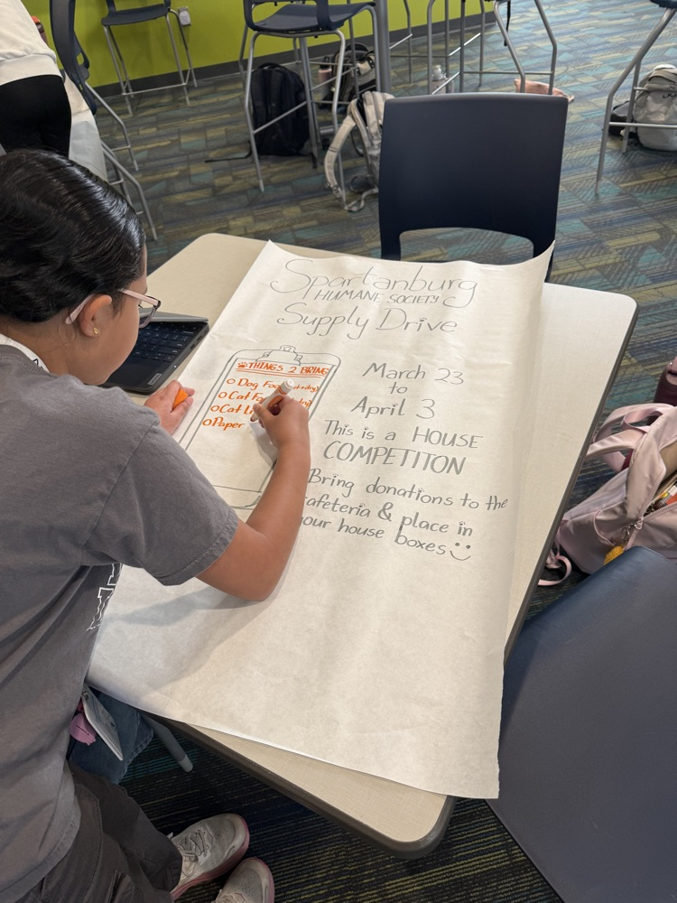 students creating boxes and posters