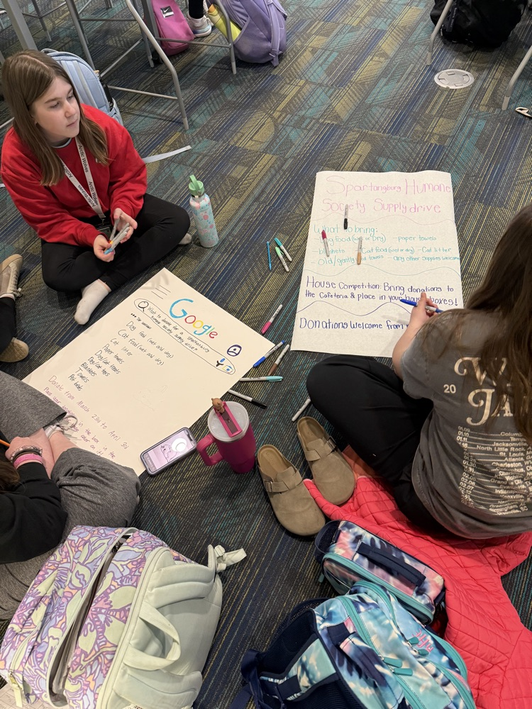 students creating boxes and posters