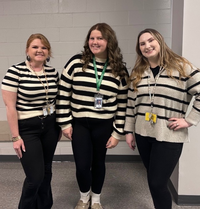 teachers and a student dressed alike 