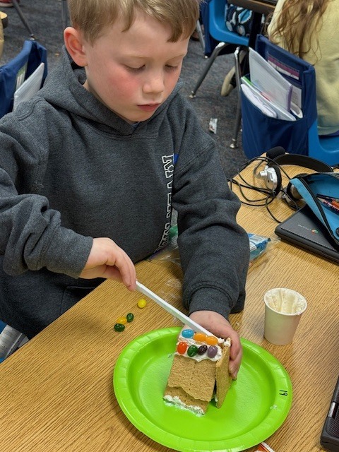 Mrs. Wells’s class had some eggs-tra egg-citing learning activities to go along with the book Rechenka’s Eggs by Patricia Polocco. They built and ate the cutest little Peep houses and measured with jellybeans.