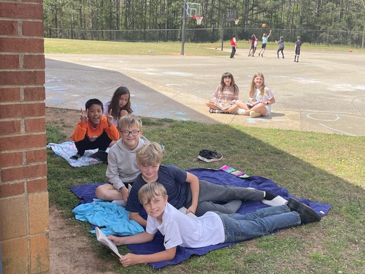 Mrs. Cobb’s classes enjoyed the sunshine while reading outside today.