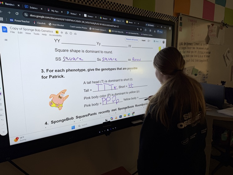 kids doing work at the board 